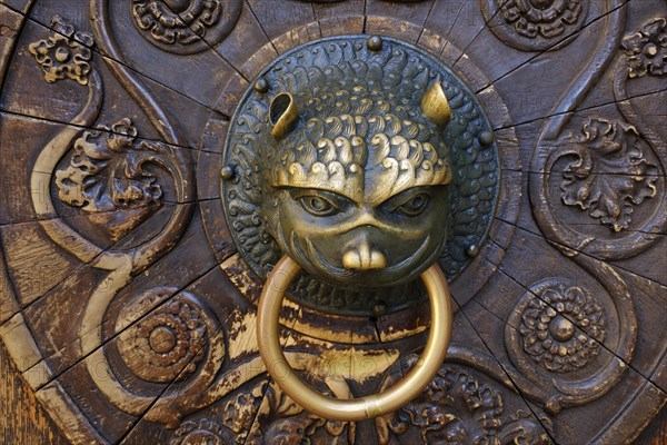 Lowenkopf as door knocker at the south portal