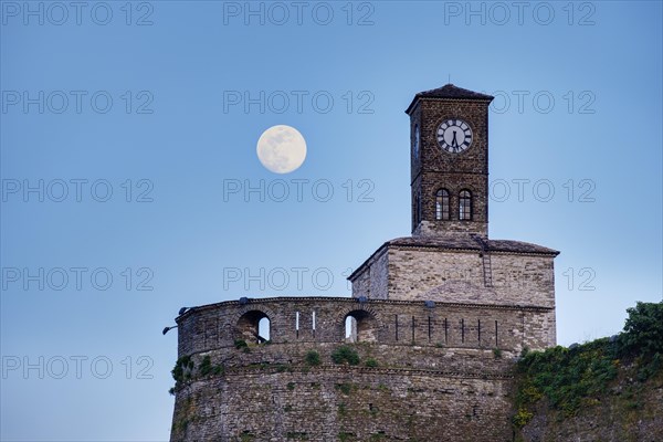 Clock tower on the castle at full moon