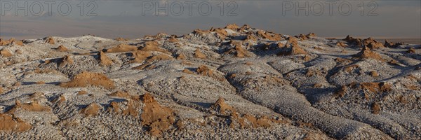 Bizarre red rock formations with white salt