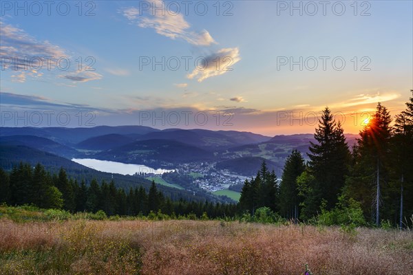 View from Hochfirst to Lake Titisee and Feldberg mountain at sunset