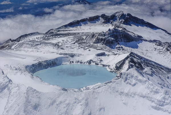 Aerial view of a tuquoise crater lake on top of Mount Ruapehu