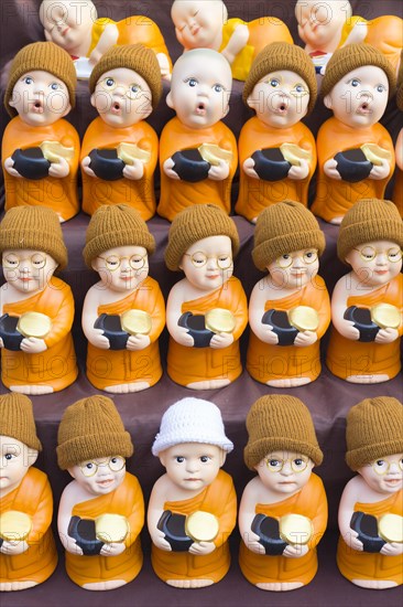 Monk toy puppets on display at the evening market