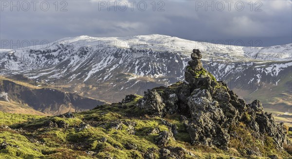 Lava formations and snowy mountains
