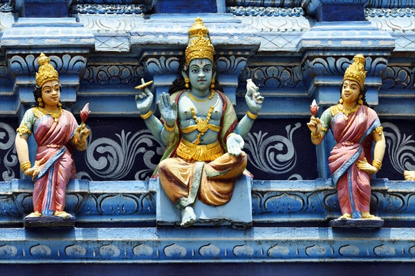 Colorful Hindu temple decorated with figures and gods