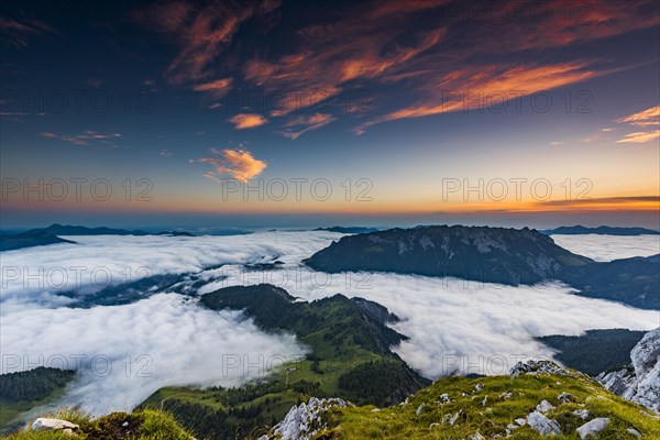 Mountain peak with sea of fog at sunrise