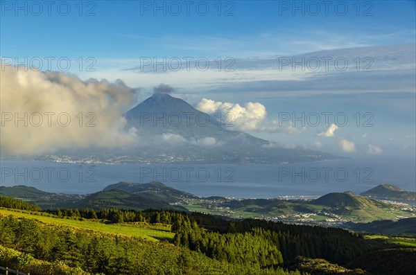 View of volcano Ponta do Pico with clouds