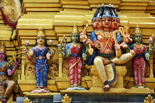 Colorful Hindu temple decorated with figures and gods