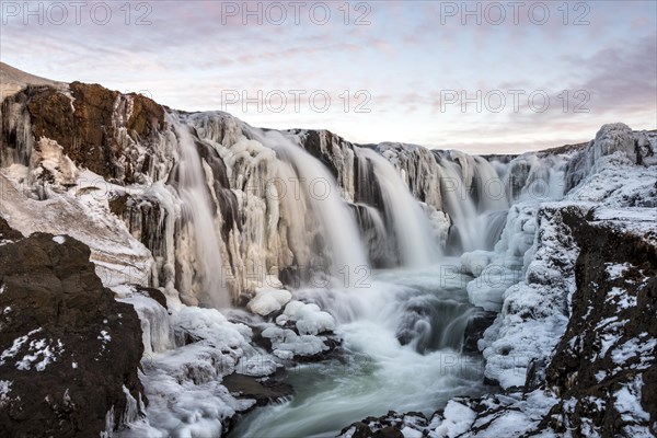 Waterfall with ice and snow in winter
