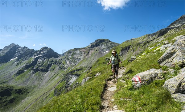 Hiker on the descent from Vetternscharte to Keinprechthutte