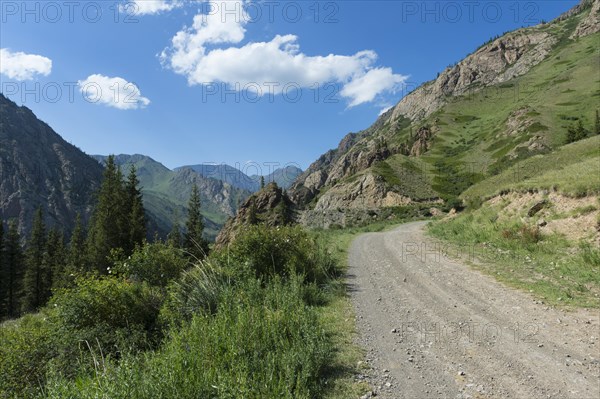 Gravel Road through mountains across Naryn gorge