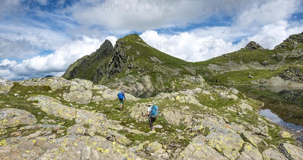 Hikers at a small lake in the Klafferkessel