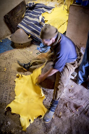 Worker working on leather