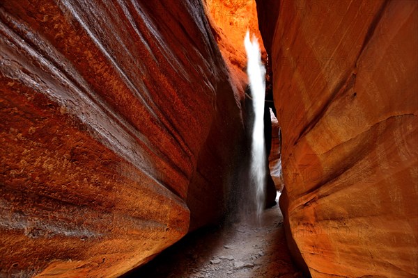 Sunrays illuminate dust flags in Peckaboo Canyon