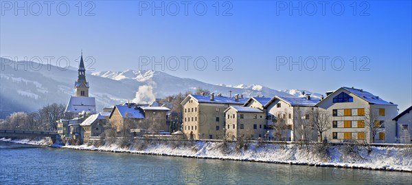 Row of houses with hospital church on the Inn in winter