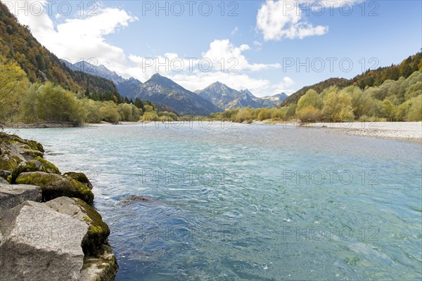 The river Lech with autumnal forest near the Ziegelwiesen