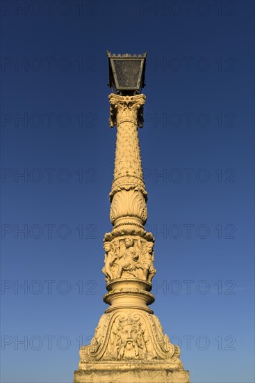 Historic lantern on the Schlossbrucke in the evening light