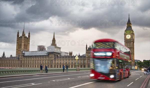 Red double-decker bus on the Westminster Bridge