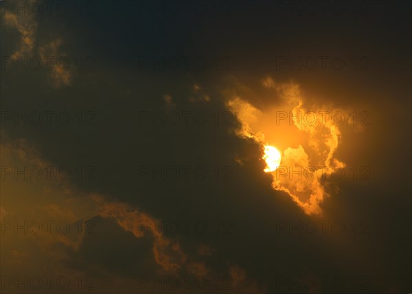 Sunset behind dark clouds
