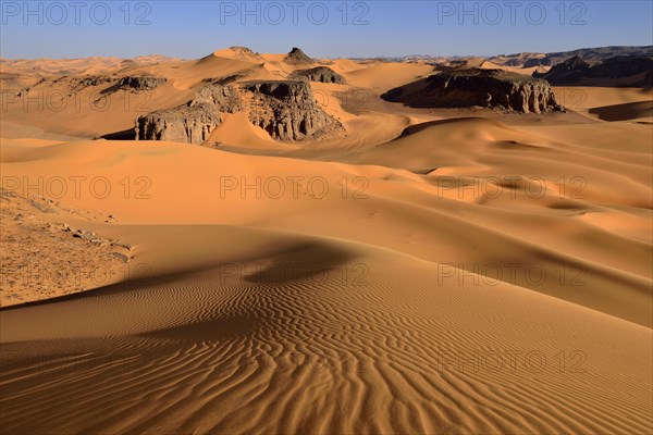 Sanddunes and rock towers at Moul Naga