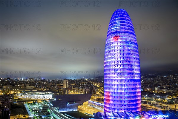 City view with illuminated Agbar Tower at night