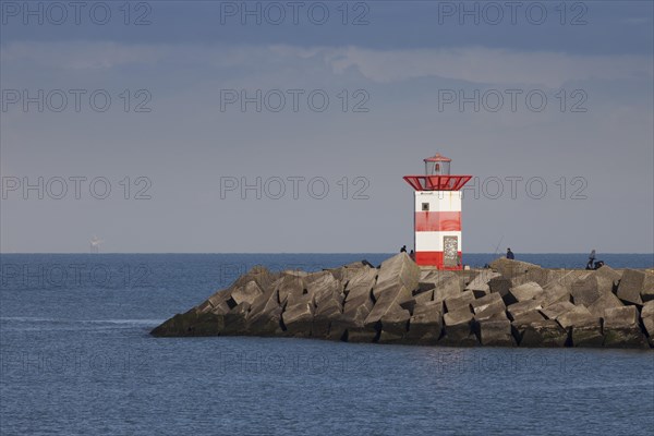 Small lighthouse at harbor entrance