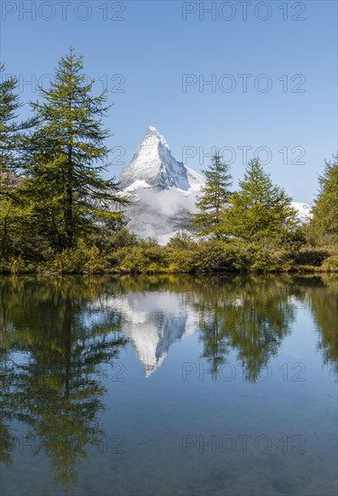 Snow-covered Matterhorn reflected in the lake