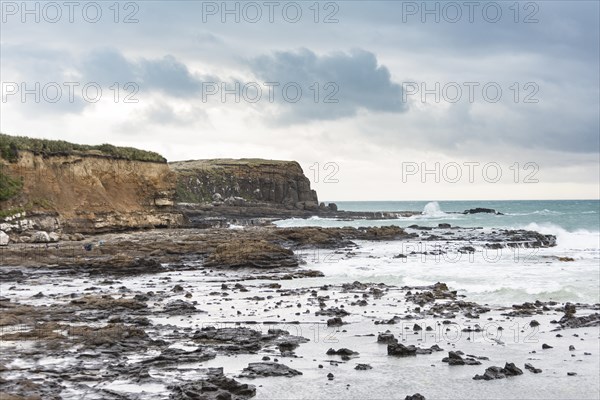 Cliffs and foaming waves