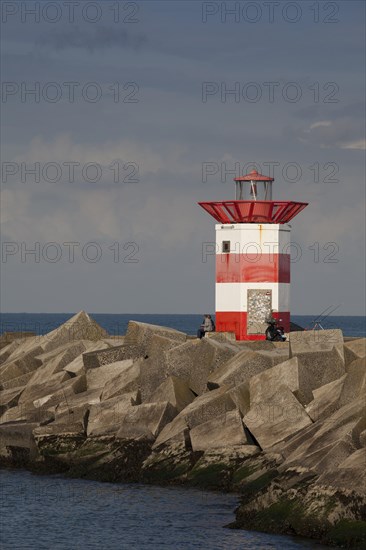 Small lighthouse at harbor entrance