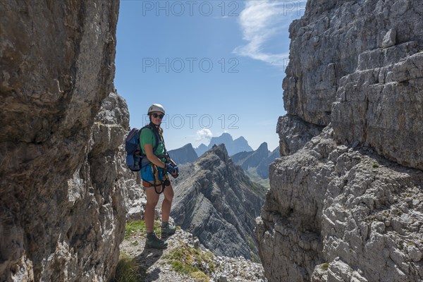 Woman on via ferrata to Averau
