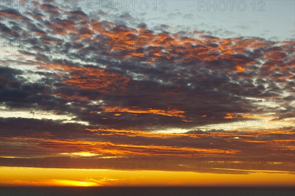 Shining sky over the Pacific Ocean at sunset