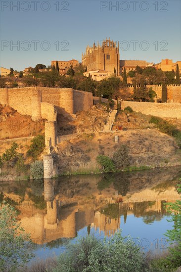 San Juan de los Reyes Church and city wall reflected in the River Tajo river