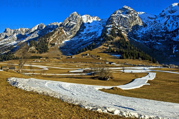 Trail of artificial snow during a snowless winter