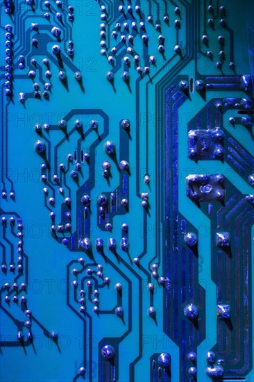 Blue and silver computer circuit board close-up