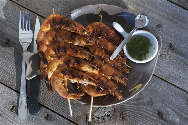 Fried shrimp served on skewers