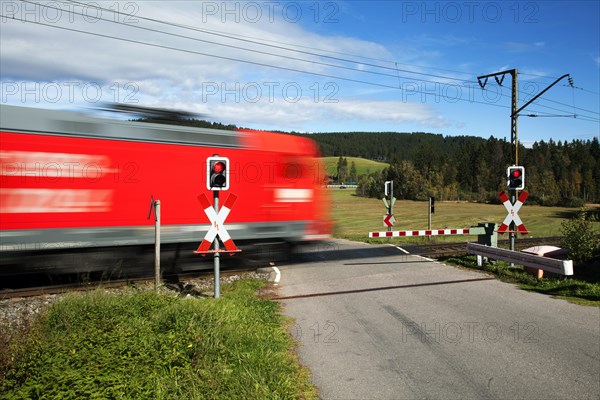 Level crossing with passing train