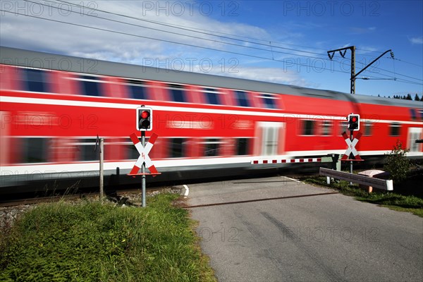Level crossing with passing train