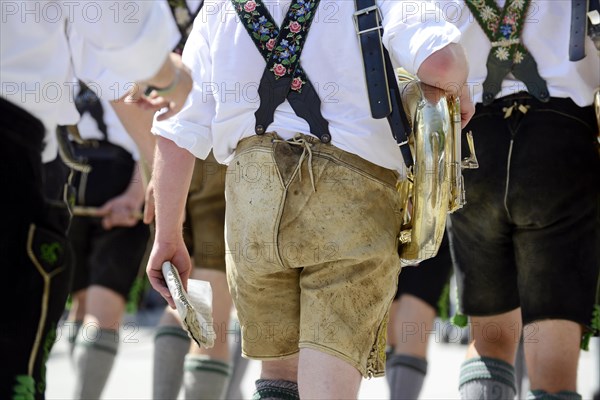 Musicians in leather trousers and Tuba