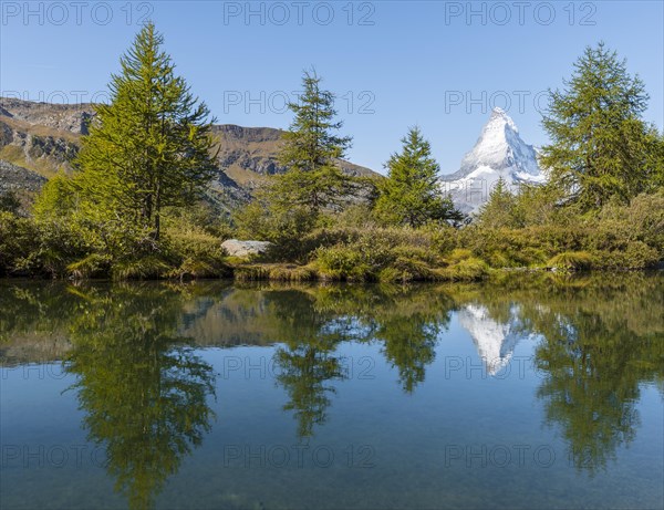 Snow-covered Matterhorn reflected in the lake