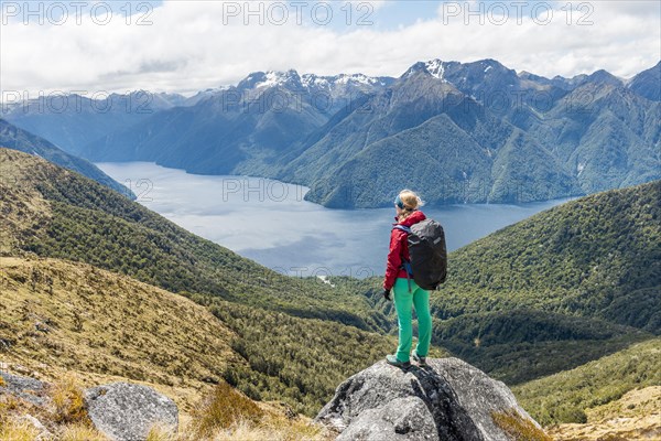 Female hiker looking at the South Fiord of Lake Te Anau