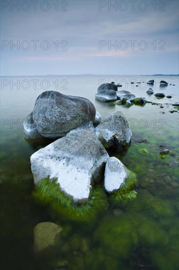 Coastline with big boulders on beach