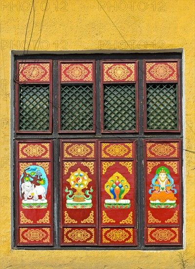 Traditional Buddhist motifs on wall