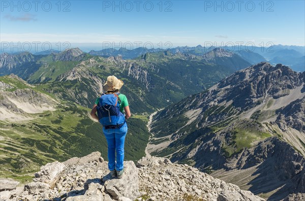 Hiker with views of mountains and Alps