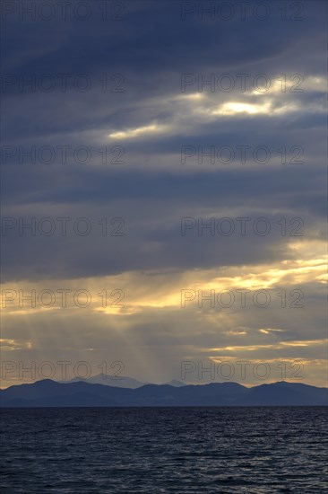 Thunderclouds at sunset on the beach