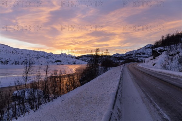Dawn over half frozen lake