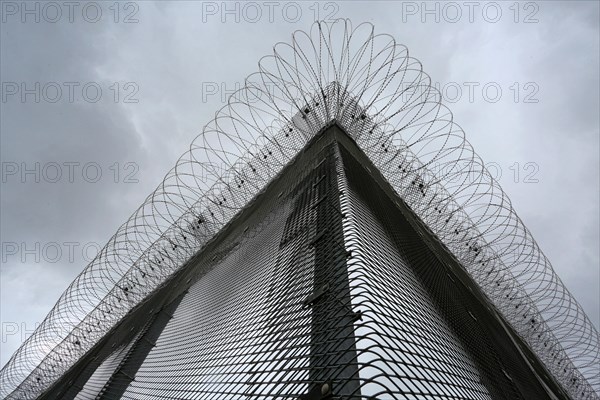 Security fence with barbed wire