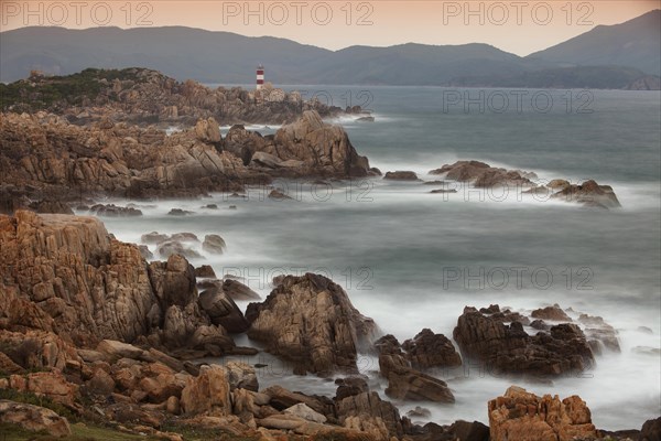 Rocky coast with lighthouse at Ganh Dia