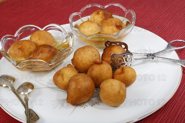 Swabian dessert on plate with pastry tongs