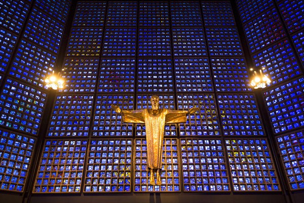 Crucifix in front of a glass facade