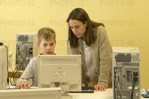Elementary school student working in computer room