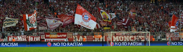 FC Bayern football fans holding flags